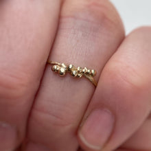 Load image into Gallery viewer, size 8 yellow gold stacking ring with granules on hand. one of a kind
