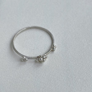 sterling silver scs recycled stacking band side profile granulation details on white background. handcrafted