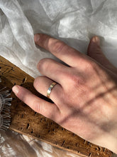 Load image into Gallery viewer, A top-down view of the Solitaire Square Male Wedding Band, showing the 4mm x 1mm band and stamped 10k hallmark