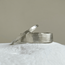 Load image into Gallery viewer, Brushed hammered wedding band made of recycled and ethical Sterling Silver. Rustic men's wedding ring with a freestyle hammered texture. 6mm wide and 1.25mm thick.