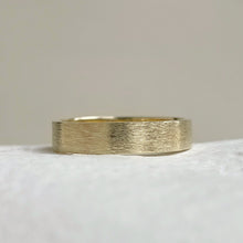 Load image into Gallery viewer, Handcrafted rustic yellow gold wedding band with a brushed texture, made from recycled 10K, 14K, or 18K gold. Perfect for weddings or as a gift for him. Available in a range of sizes.
