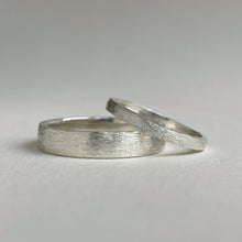Load image into Gallery viewer, Handcrafted rustic wedding band in Sterling Silver with a unique texture, available in a range of sizes, and gift-wrapped. Perfect as a men's wedding ring or a gift for him.