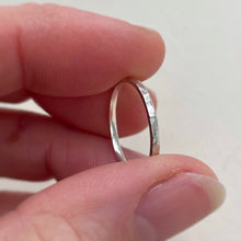 Load image into Gallery viewer, Thin hammered Sterling Silver wedding band with a freestyle texture, available in a range of sizes, and gift-wrapped. Measures 1.5mm in width and 1.25mm in thickness. Perfect as a minimal and unique wedding ring for her.