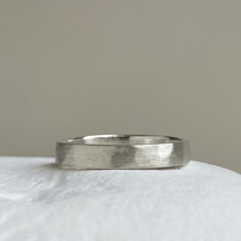 Load image into Gallery viewer, Close-up of the freestyle hammered texture on the brushed textured wedding band