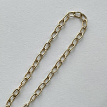 Load image into Gallery viewer, Solid gold charm bracelet with a fine link chain and a rustic texture, crafted by hand with ethically sourced and recycled 10kt yellow gold. Comes with an adjustable clasp and lobster clasp, and a tag with a metal stamp and makers mark.