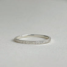 Load image into Gallery viewer, Thin hammered Sterling Silver wedding band with a freestyle texture, available in a range of sizes, and gift-wrapped. Measures 1.5mm in width and 1.25mm in thickness. Perfect as a minimal and unique wedding ring for her.
