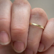 Load image into Gallery viewer, Handcrafted thin rustic yellow gold wedding band with minimal texture, ethically sourced and available in a range of sizes