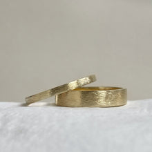 Load image into Gallery viewer, Handcrafted thin rustic yellow gold wedding band with minimal texture, ethically sourced and available in a range of sizes
