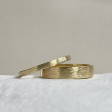 Load image into Gallery viewer, Handcrafted thin rustic yellow gold wedding band with minimal texture, ethically sourced and available in a range of sizes
