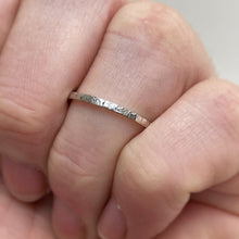 Load image into Gallery viewer, Thin hammered Sterling Silver wedding band with a freestyle texture, available in a range of sizes, and gift-wrapped. Measures 1.5mm in width and 1.25mm in thickness. Perfect as a minimal and unique wedding ring for her.