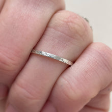 Load image into Gallery viewer, Thin hammered Sterling Silver wedding band with a freestyle texture, available in a range of sizes, and gift-wrapped. Measures 1.5mm in width and 1.25mm in thickness. Perfect as a minimal and unique wedding ring for her.