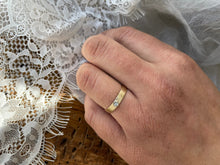 Load image into Gallery viewer, A close-up of a Solitaire Square Male Wedding Band in 10kt yellow gold and white gold setting, featuring a square white sapphire in the center