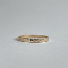 Load image into Gallery viewer, Image of a handcrafted thin 2mm hammered finish yellow gold wedding band with a freestyle hammered texture. The band is ethically sourced and made using recycled 10kt, 14kt, or 18kt yellow gold. The band is stamped with its karat weight and hallmarked. Available in various sizes and made to order, shipping includes tracking within Canada and the United States, and internationally
