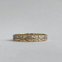 Load image into Gallery viewer, Image of a 4mm yellow gold geometric wedding band, handcrafted with recycled ethical gold, stamped and hallmarked