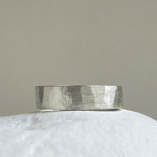 Load image into Gallery viewer, Brushed hammered wedding band made of recycled and ethical Sterling Silver. Rustic men&#39;s wedding ring with a freestyle hammered texture. 6mm wide and 1.25mm thick.
