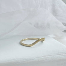 Load image into Gallery viewer, A close-up image of a handcrafted yellow gold wedding band with a high arch and rustic texture. Made with recycled ethical gold and stamped with 10k, 14k, or 18k. Available in a range of sizes.