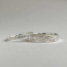 Load image into Gallery viewer, Thin hammered Sterling Silver wedding band with a freestyle texture, available in a range of sizes, and gift-wrapped. Measures 1.5mm in width and 1.25mm in thickness. Perfect as a minimal and unique wedding ring for her