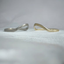 Load image into Gallery viewer, A close-up image of a handcrafted yellow gold wedding band with a high arch and rustic texture. Made with recycled ethical gold and stamped with 10k, 14k, or 18k. Available in a range of sizes.