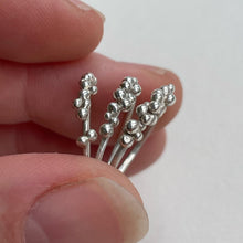 Load image into Gallery viewer, Three one of a kind sterling silver stacking rings with granulated details in hand on white background ethically made
