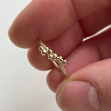 Load image into Gallery viewer, size 8 scs recycled yellow gold granulation ring in hand close up on white background
