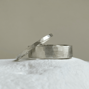 Brushed hammered wedding band made of recycled and ethical Sterling Silver. Rustic men's wedding ring with a freestyle hammered texture. 6mm wide and 1.25mm thick.