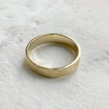 Load image into Gallery viewer, Handcrafted rustic yellow gold wedding band with a brushed texture, made from recycled 10K, 14K, or 18K gold. Perfect for weddings or as a gift for him. Available in a range of sizes.
