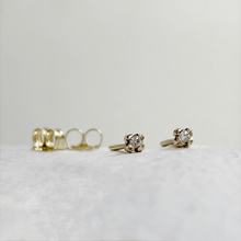 Load image into Gallery viewer, Handcrafted 10kt yellow gold rose bud stud earrings with two round white sapphires. These minimalist earrings are ready to ship and come gift-wrapped
