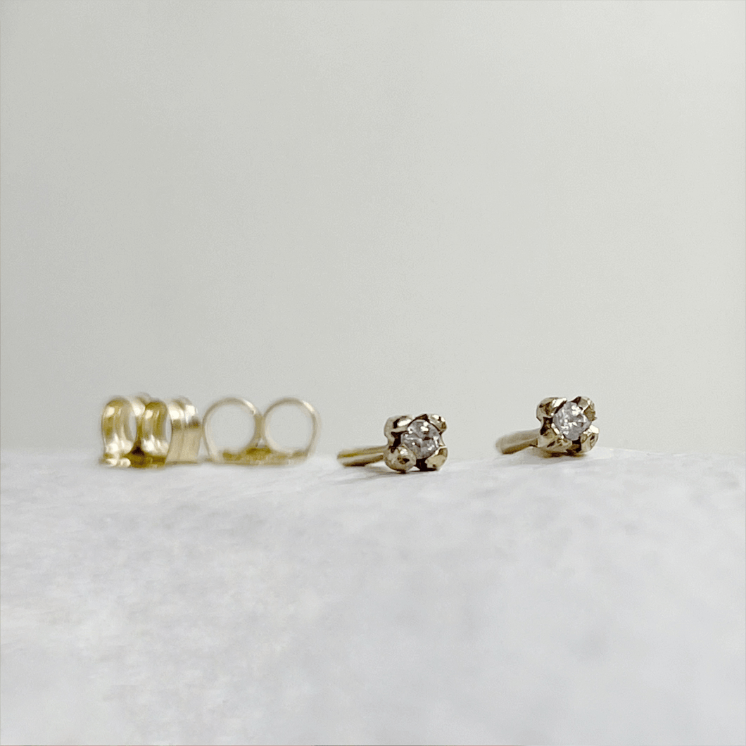 Handcrafted 10kt yellow gold rose bud stud earrings with two round white sapphires. These minimalist earrings are ready to ship and come gift-wrapped
