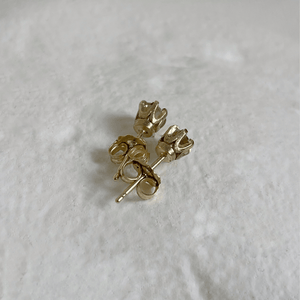 Solid gold crown stud earrings with round claw-set white sapphires, handmade in 10kt, 14kt, or 18kt yellow gold. These vintage-inspired earrings are ethically sourced and come gift-wrapped