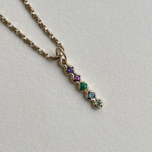 Handcrafted Solid Gold Family Pendant with Birthstone Charms, featuring customizable ethically sourced 2mm genuine gemstones. Perfect personalized gift for Mother's Day, birthdays, and anniversaries. Pendant chain not included.