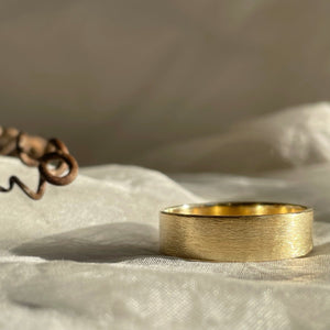 6mm Rustic Yellow Gold Wedding Band with minimal texture, made to order using ethical SCS recycled gold.