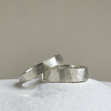 Load image into Gallery viewer, Close-up of the freestyle hammered texture on the brushed textured wedding band
