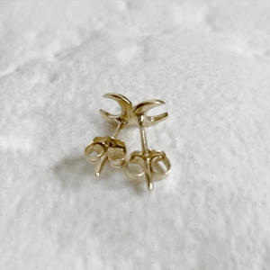 Handcrafted 10kt yellow gold lunar stud earrings, perfect for everyday wear. These minimalist earrings capture the essence of the moon and come gift-wrapped.