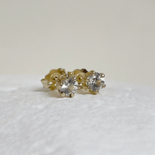 Load image into Gallery viewer, Solid gold crown stud earrings with round claw-set white sapphires, handmade in 10kt, 14kt, or 18kt yellow gold. These vintage-inspired earrings are ethically sourced and come gift-wrapped
