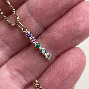Handcrafted Solid Gold Family Pendant with Birthstone Charms, featuring customizable ethically sourced 2mm genuine gemstones. Perfect personalized gift for Mother's Day, birthdays, and anniversaries. Pendant chain not included.
