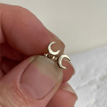 Load image into Gallery viewer, Handcrafted 10kt yellow gold lunar stud earrings, perfect for everyday wear. These minimalist earrings capture the essence of the moon and come gift-wrapped.
