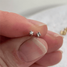Load image into Gallery viewer, Handcrafted 10kt yellow gold rose bud stud earrings with two round white sapphires. These minimalist earrings are ready to ship and come gift-wrapped
