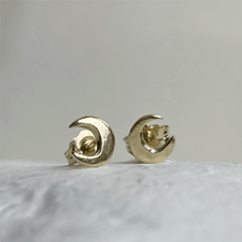 Load image into Gallery viewer, Handcrafted 10kt yellow gold lunar stud earrings, perfect for everyday wear. These minimalist earrings capture the essence of the moon and come gift-wrapped.
