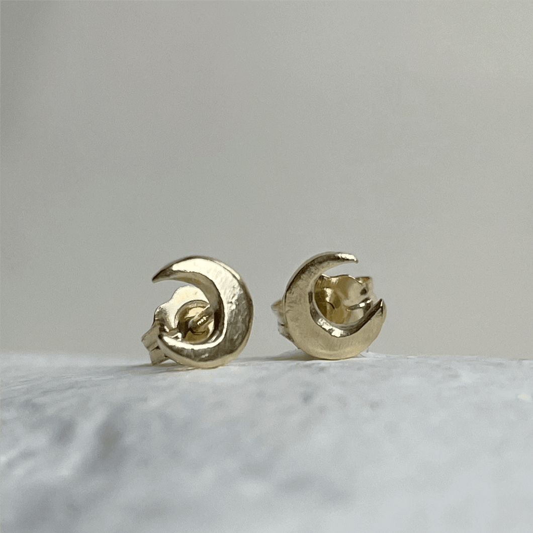 Handcrafted 10kt yellow gold lunar stud earrings, perfect for everyday wear. These minimalist earrings capture the essence of the moon and come gift-wrapped.