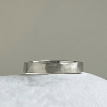 Load image into Gallery viewer, Close-up of the freestyle hammered texture on the brushed textured wedding band&quot;
